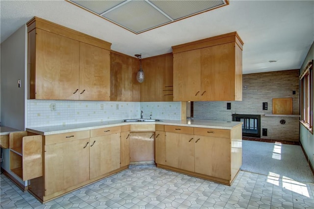8303 163rd St, Chippewa Falls, WI 54729 - kitchen with light countertops, decorative backsplash, light brown cabinets, extractor fan, and hanging light fixtures
