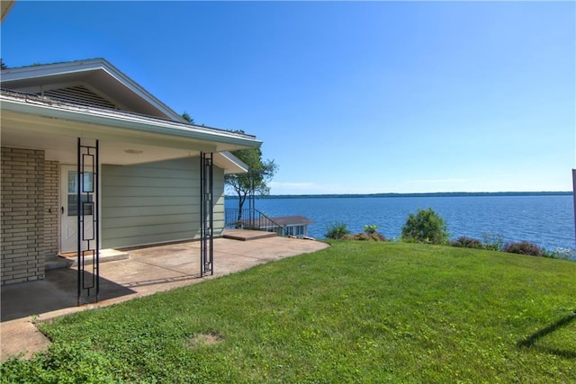 8303 163rd St, Chippewa Falls, WI 54729 - view of green lawn featuring a water view and a patio area
