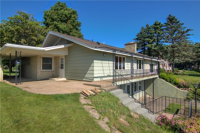 8303 163rd St, Chippewa Falls, WI 54729 - back of house with a patio area, stairs, a chimney, and a yard