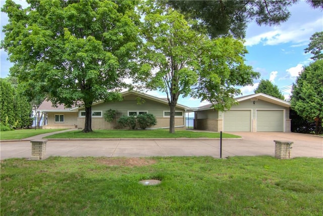 8303 163rd St, Chippewa Falls, WI 54729 - single story home featuring concrete driveway, a front yard, brick siding, and a garage