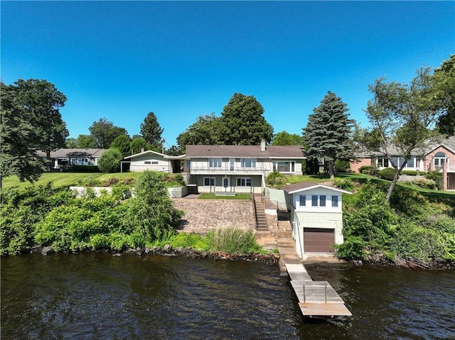 8303 163rd St, Chippewa Falls, WI 54729 - rear view of property featuring stairs, a water view, and an attached garage