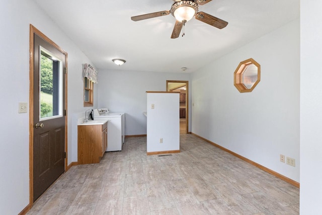 N3661 Peters Rd, La Crosse, WI 54601 - laundry room with cabinet space, light wood-type flooring, and baseboards