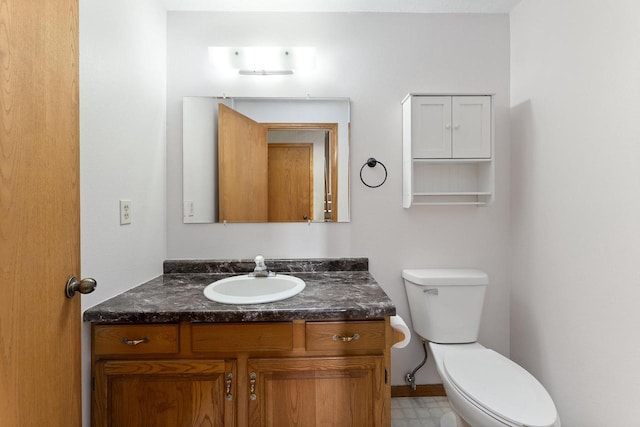 N3661 Peters Rd, La Crosse, WI 54601 - half bathroom with vanity, toilet, baseboards, and tile patterned floors