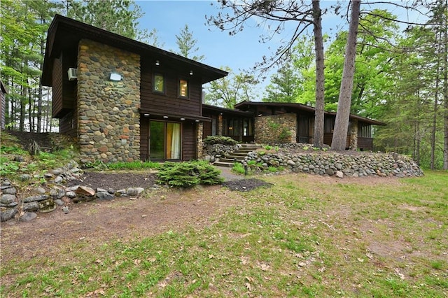 N5575 Schultz Ln, Stone Lake, WI 54876 - back of house featuring stone siding