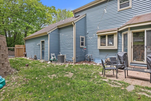 S69W32641 Westgate Dr, Mukwonago, WI 53149 - back of house with central AC unit, a patio area, and entry steps