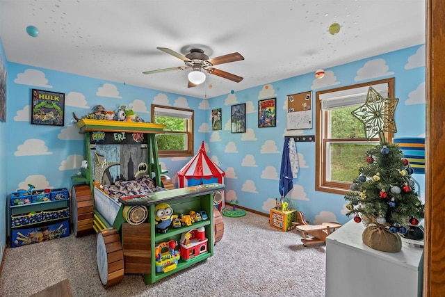 S69W32641 Westgate Dr, Mukwonago, WI 53149 - game room with ceiling fan, carpet, healthy amount of natural light, and baseboards