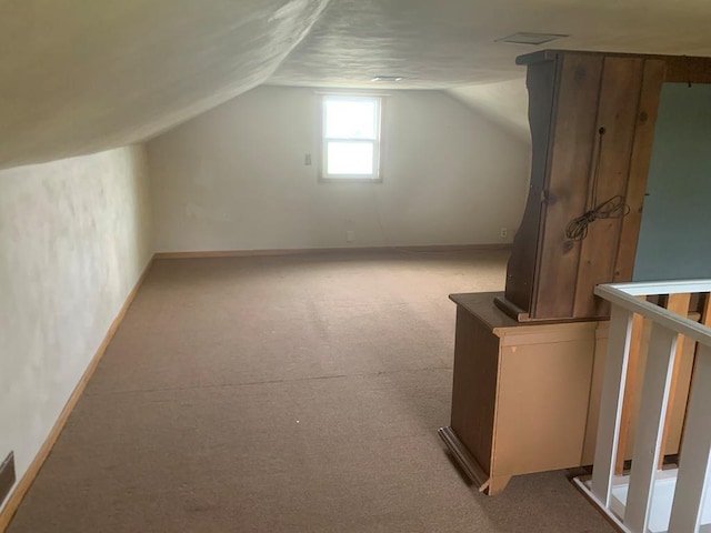 2811 Willow Dr, Plover, WI 54467 - bonus room featuring carpet, lofted ceiling, and baseboards