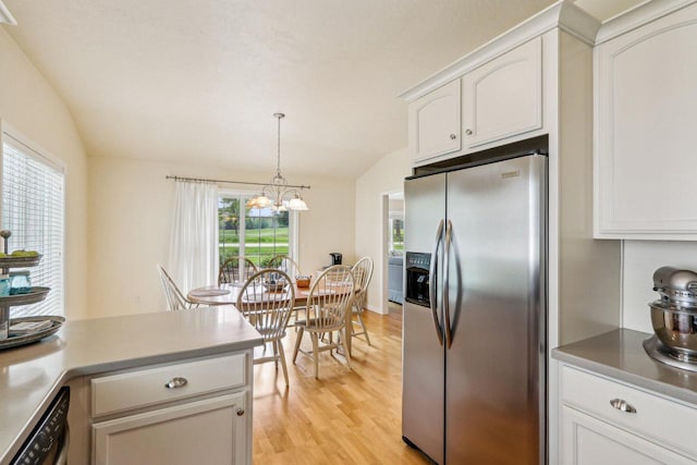 522 Otto Way, Elkhart Lake, WI 53020 - kitchen with stainless steel fridge with ice dispenser, dishwasher, light wood-type flooring, a chandelier, and white cabinetry