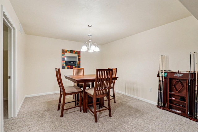 522 Otto Way, Elkhart Lake, WI 53020 - dining room with carpet floors, a chandelier, and baseboards