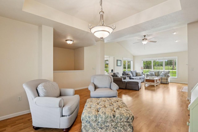522 Otto Way, Elkhart Lake, WI 53020 - living area with wood finished floors, lofted ceiling, baseboards, and ceiling fan