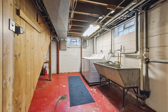 2507 S 94th St, West Allis, WI 53227 - below grade area with washing machine and dryer, electric panel, and a sink
