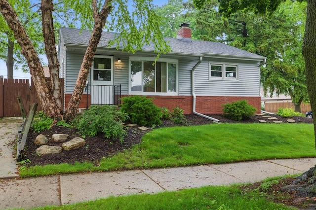 2507 S 94th St, West Allis, WI 53227 - view of front of house featuring brick siding, a chimney, and a shingled roof