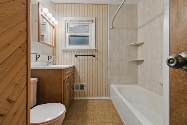 2507 S 94th St, West Allis, WI 53227 - full bathroom featuring toilet, vanity, wallpapered walls, tub / shower combination, and baseboards