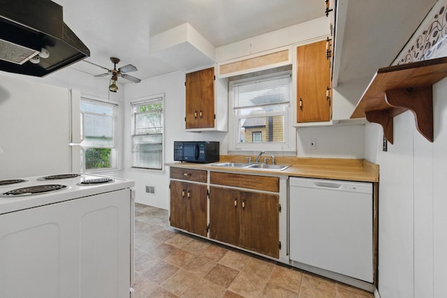 2507 S 94th St, West Allis, WI 53227 - kitchen featuring white appliances, a sink, range hood, ceiling fan, and light countertops