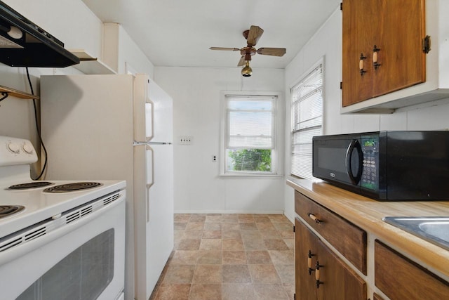 2507 S 94th St, West Allis, WI 53227 - kitchen featuring white electric range oven, black microwave, extractor fan, stone finish flooring, and brown cabinets