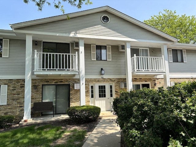 788 S River Rd Unit 7, West Bend, WI 53095 - view of front of property with a balcony and brick siding