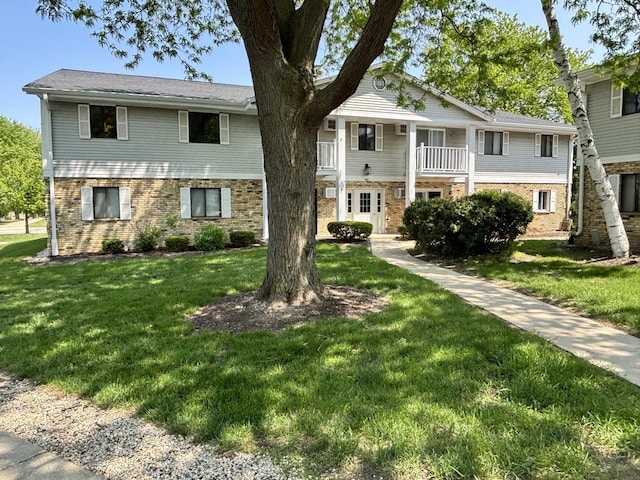 788 S River Rd Unit 7, West Bend, WI 53095 - view of front of home featuring brick siding and a front lawn