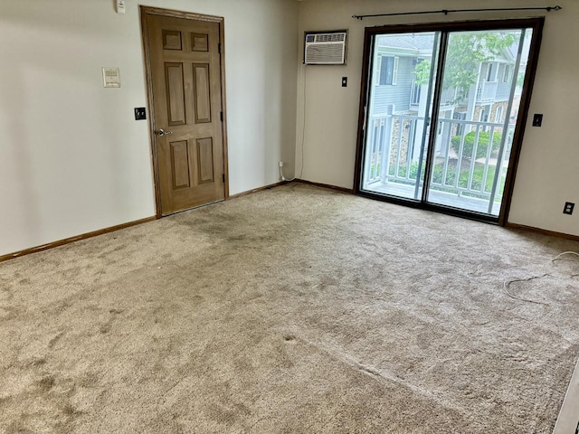 788 S River Rd Unit 7, West Bend, WI 53095 - carpeted spare room featuring baseboards and an AC wall unit