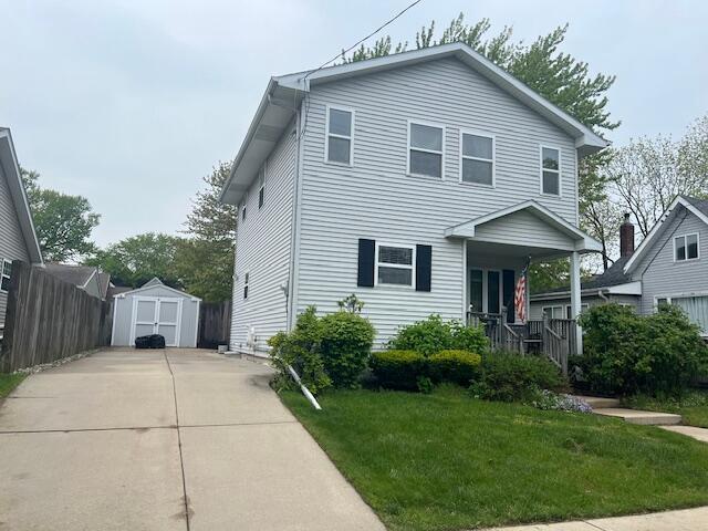1906 Erie St, Racine, WI 53402 - traditional-style house with a porch