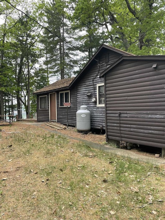 W5522 S Round Lake Rd, Wild Rose, WI 54984 - back of property featuring log veneer siding