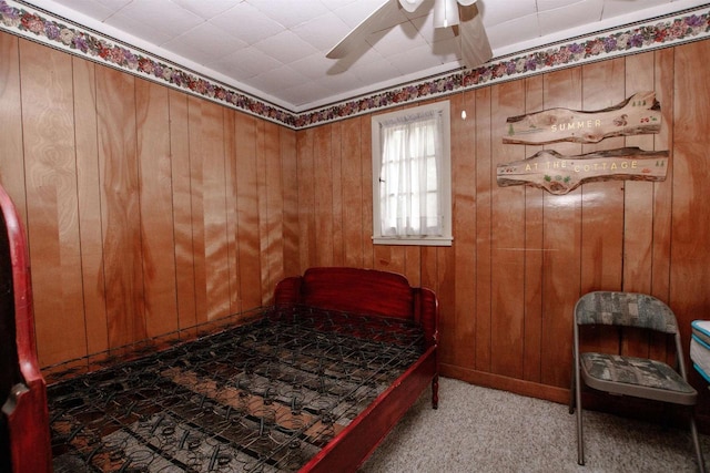 W5522 S Round Lake Rd, Wild Rose, WI 54984 - bedroom featuring wood walls, carpet flooring, and a ceiling fan