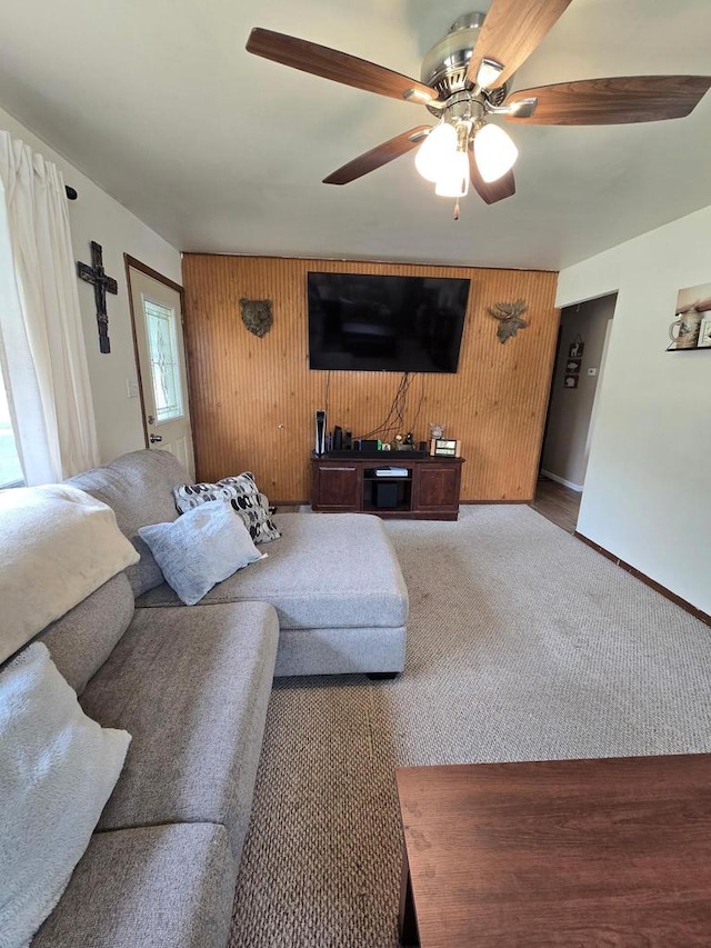 1413 E Marquette St, Appleton, WI 54911 - carpeted living area featuring ceiling fan, baseboards, and wood walls