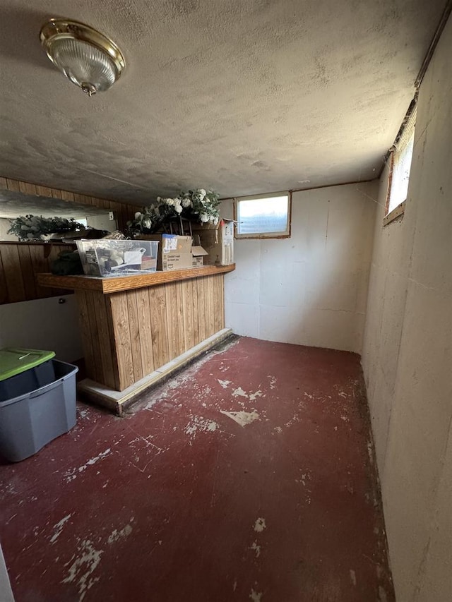 1413 E Marquette St, Appleton, WI 54911 - basement with a dry bar, plenty of natural light, and a textured ceiling