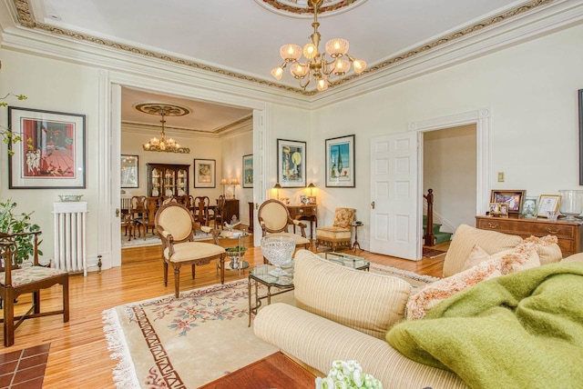150 Rountree Ave, Platteville, WI 53818 - living area with a chandelier, ornamental molding, a tray ceiling, and light wood finished floors