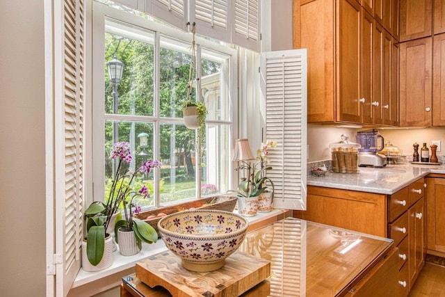 150 Rountree Ave, Platteville, WI 53818 - kitchen featuring brown cabinetry and light stone counters