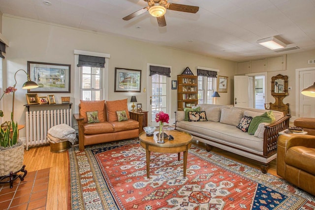 150 Rountree Ave, Platteville, WI 53818 - living room with radiator, wood finished floors, and ceiling fan