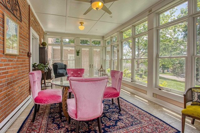 150 Rountree Ave, Platteville, WI 53818 - sunroom featuring baseboard heating, plenty of natural light, brick wall, and ceiling fan