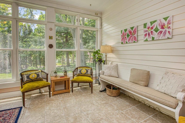 150 Rountree Ave, Platteville, WI 53818 - sunroom / solarium with healthy amount of natural light, an outdoor hangout area, wooden walls, and ornamental molding