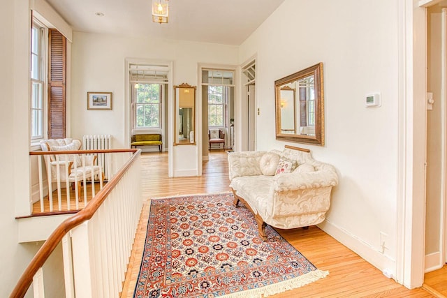 150 Rountree Ave, Platteville, WI 53818 - sitting room featuring light wood finished floors, radiator, and baseboards