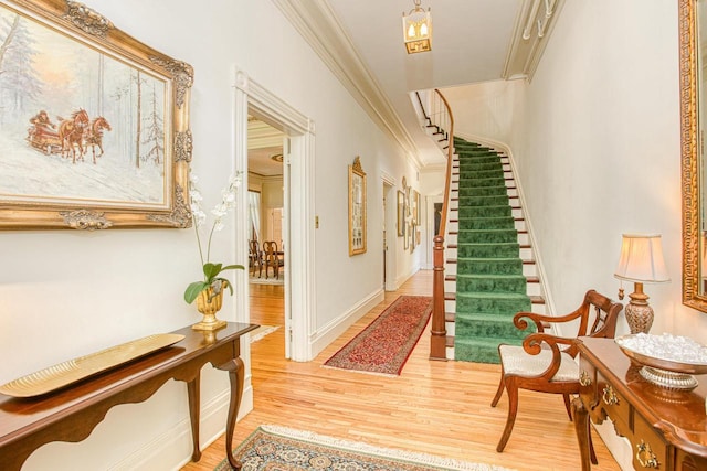 150 Rountree Ave, Platteville, WI 53818 - entryway with crown molding, wood finished floors, stairs, and baseboards