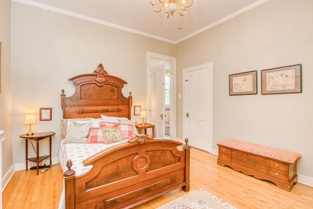 150 Rountree Ave, Platteville, WI 53818 - bedroom featuring a chandelier, light wood-style floors, crown molding, and baseboards