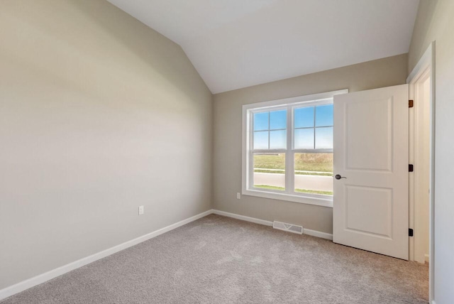 1320 Prairie Creek Cir Unit 2, Oconomowoc, WI 53066 - empty room featuring light colored carpet and lofted ceiling