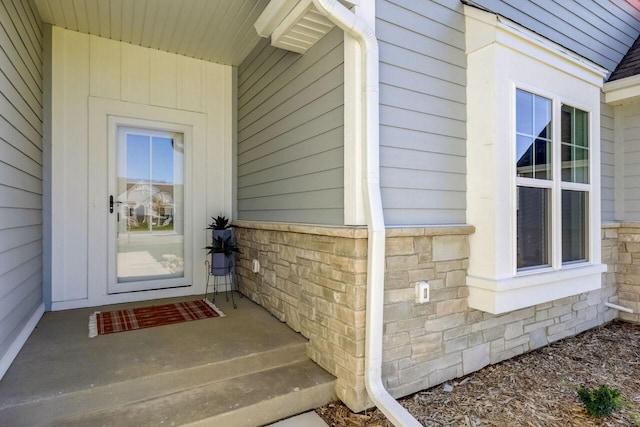 1320 Prairie Creek Cir Unit 2, Oconomowoc, WI 53066 - doorway to property featuring stone siding