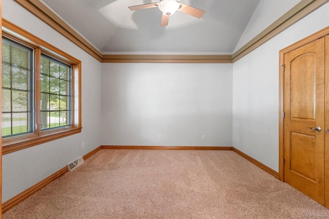 448 Harvest Rd, Green Bay, WI 54302 - spare room featuring light carpet, vaulted ceiling, a ceiling fan, and baseboards