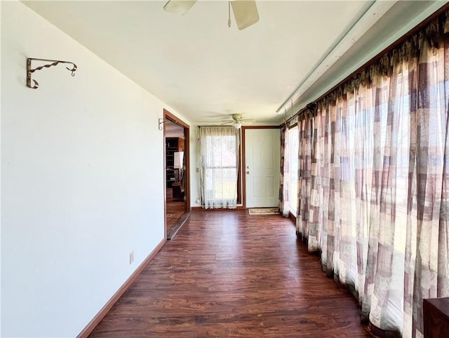 999 Mcgill Point Rd, Weyerhaeuser, WI 54895 - empty room with a ceiling fan, dark wood-style floors, and baseboards