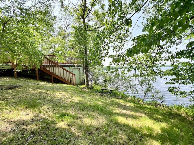 999 Mcgill Point Rd, Weyerhaeuser, WI 54895 - view of yard featuring stairs and a deck with water view