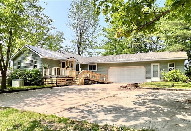 999 Mcgill Point Rd, Weyerhaeuser, WI 54895 - single story home featuring a garage, concrete driveway, and metal roof