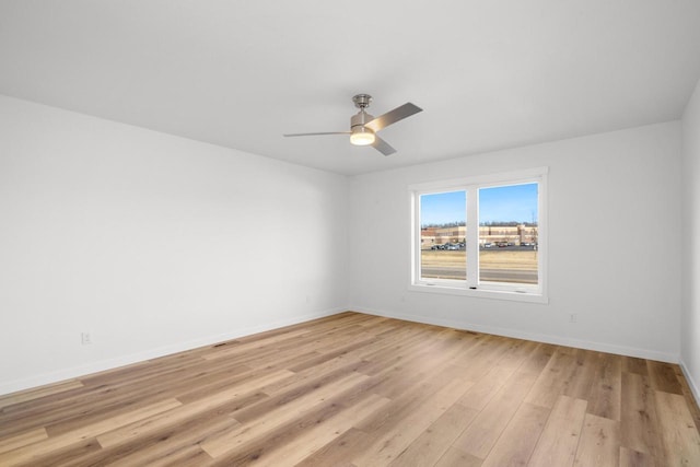 1200 Sween Dr Unit 4, Holmen, WI 54636 - empty room with ceiling fan, baseboards, and light wood-type flooring