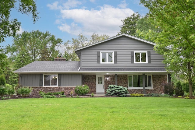15710 Kata Dr, Elm Grove, WI 53122 - traditional-style home with brick siding, a front lawn, and roof with shingles