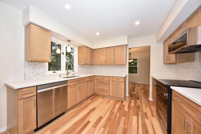 15710 Kata Dr, Elm Grove, WI 53122 - kitchen with stainless steel appliances, a sink, light brown cabinetry, plenty of natural light, and recessed lighting