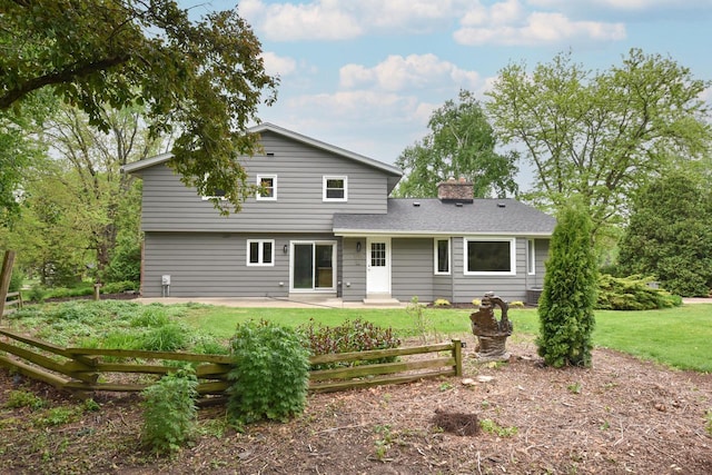 15710 Kata Dr, Elm Grove, WI 53122 - rear view of house with a patio and a chimney