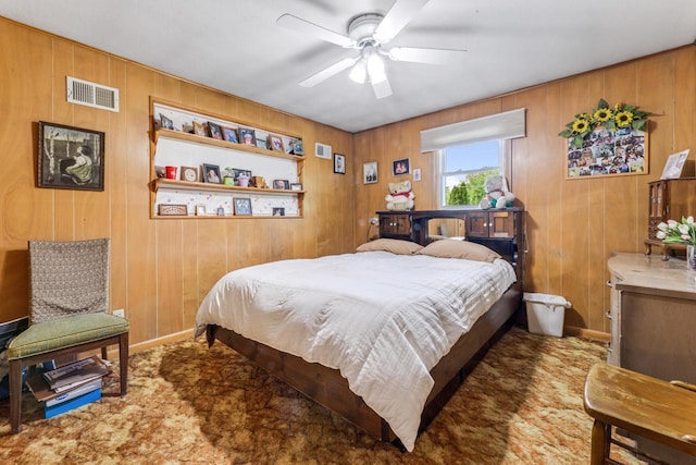 N2092 Irish Ct, La Crosse, WI 54601 - bedroom featuring carpet flooring, wood walls, baseboards, and ceiling fan