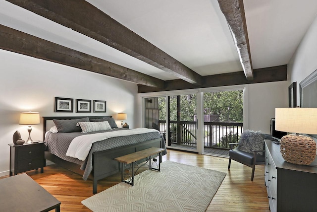 940 Alpine Dr Unit 01, Fontana, WI 53125 - bedroom with beam ceiling, access to outside, and hardwood / wood-style floors