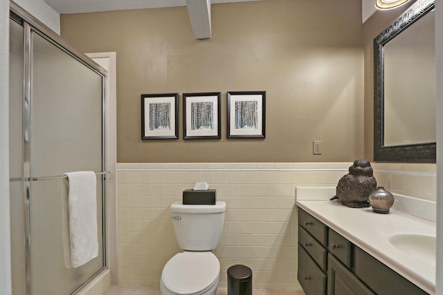 940 Alpine Dr Unit 01, Fontana, WI 53125 - bathroom featuring vanity, a shower stall, toilet, wainscoting, and tile walls