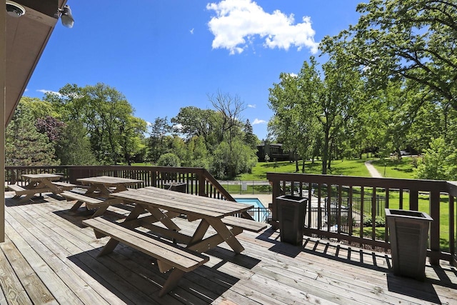 940 Alpine Dr Unit 01, Fontana, WI 53125 - wooden deck featuring a yard and view of scattered trees