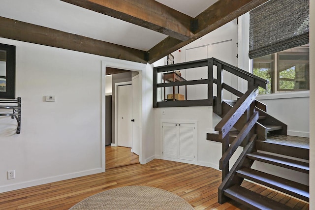 940 Alpine Dr Unit 01, Fontana, WI 53125 - stairway featuring wood finished floors and baseboards